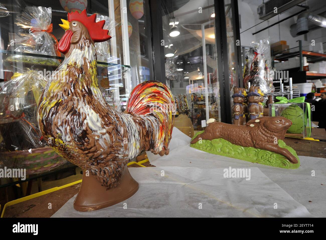 06 April 2012 - New York - A chocolate rooster (L) and 'running' rabbit (R) cool on shelves before being wrapped and put out on display at Jacques Torres Chocolates' Hudson Street retail store in anticipation of Easter Holiday weekend, April 6, 2012, New York, NY. Photo Credit: Anthony Behar/Sipa Press Stock Photo