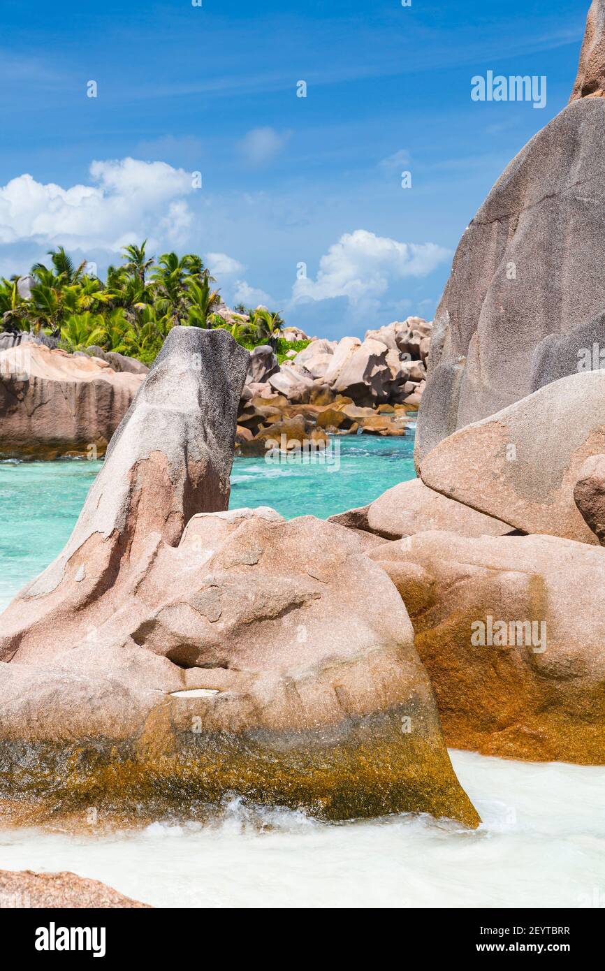 Granite rock formations and turquoise water at Anse Cocos in La Digue, Seychelles Stock Photo