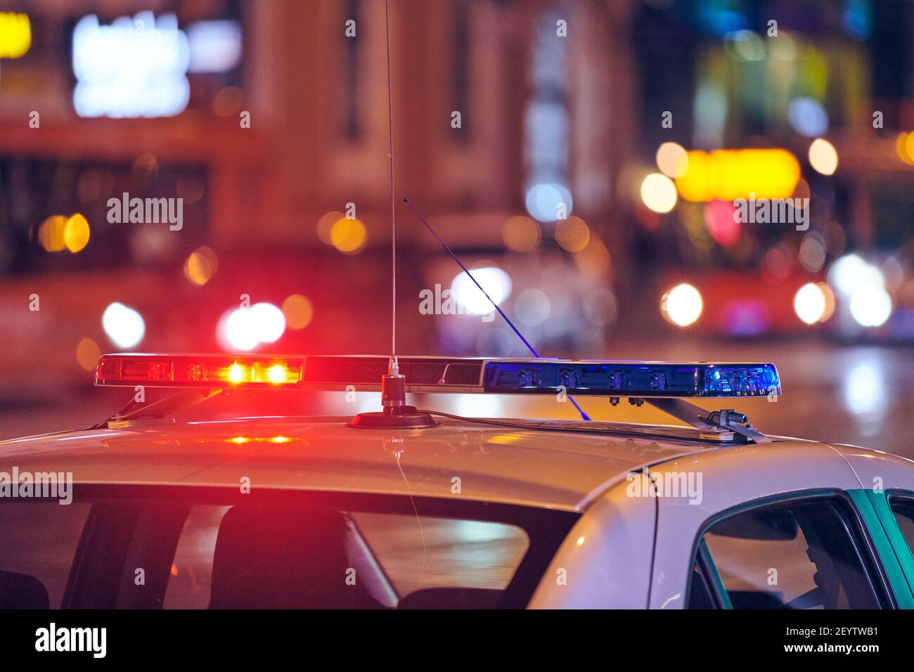 Police car lights at night city street. Red and blue lights. Road traffic accident. Evening patrolling Stock Photo