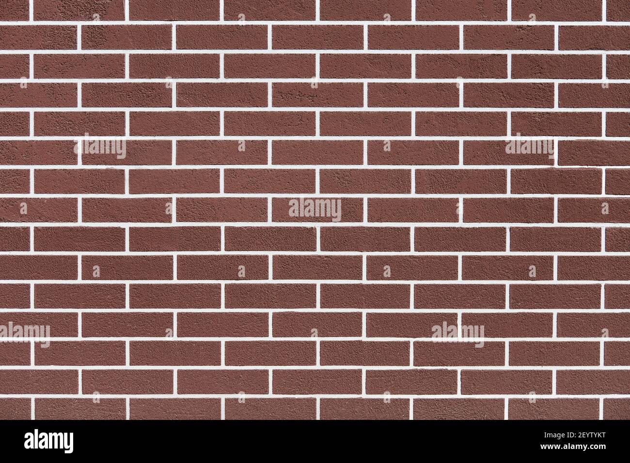 Brown brick wall with white grout lines pattern. Abstract brick texture