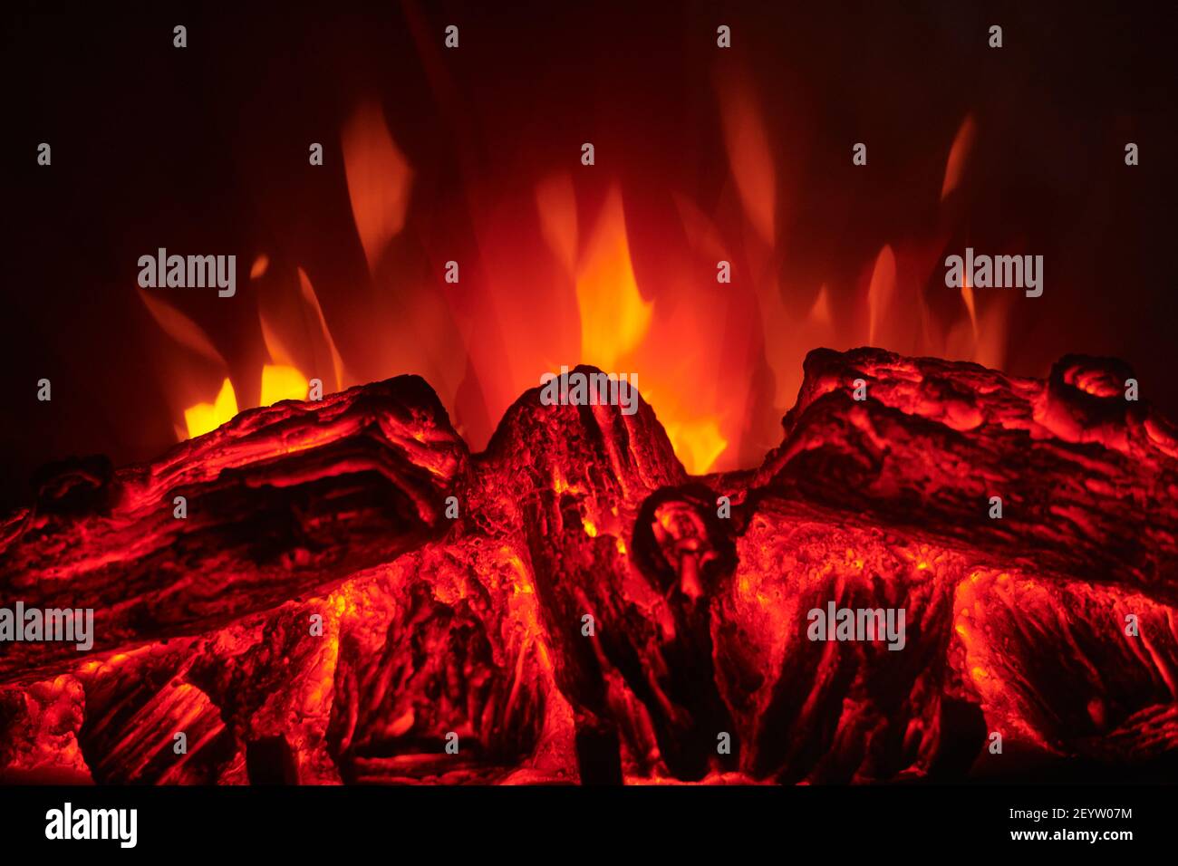 Artificial electric fireplace with red, orange and yellow flame