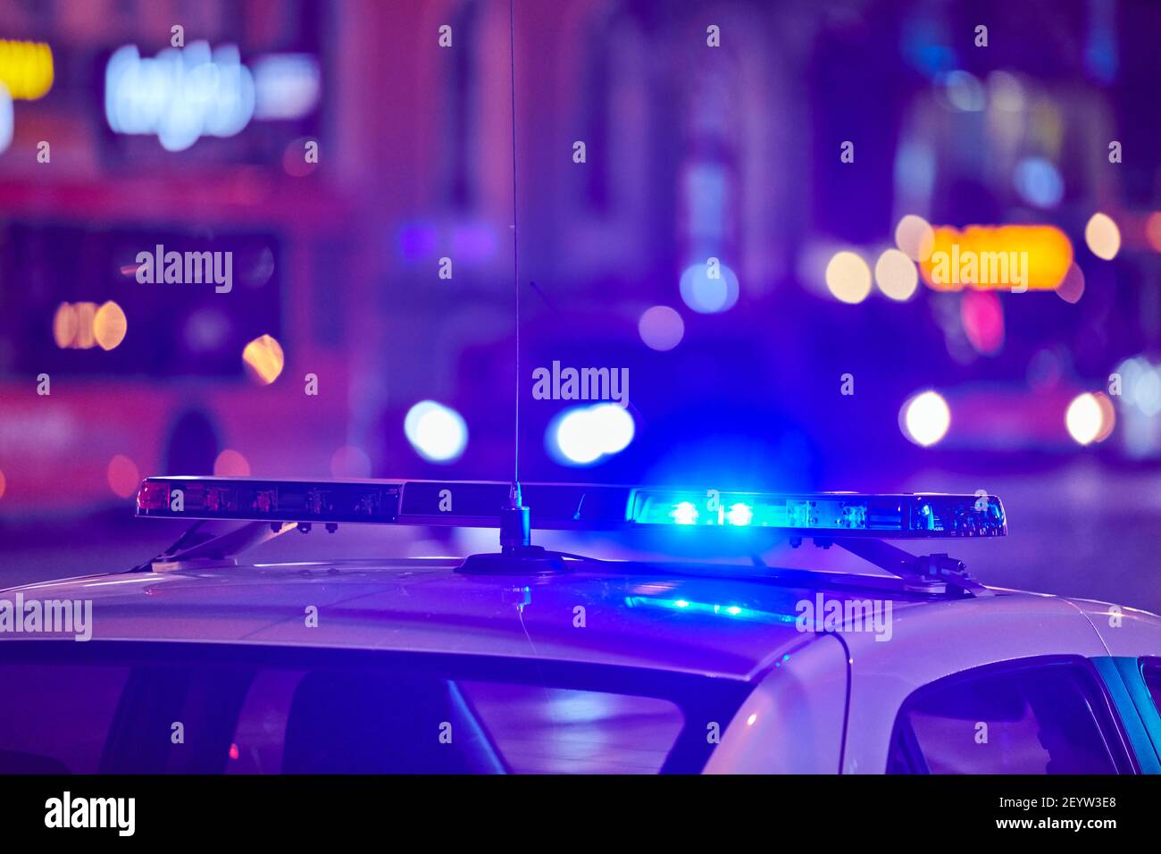 Police car lights at night city street. Red and blue lights. Road traffic accident. Evening patrolling Stock Photo