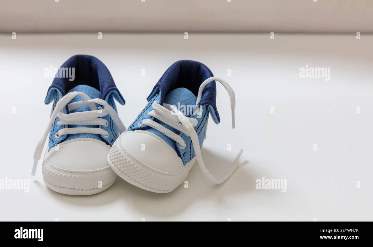 Baby boy sport shoes on white color background. Kid small size blue