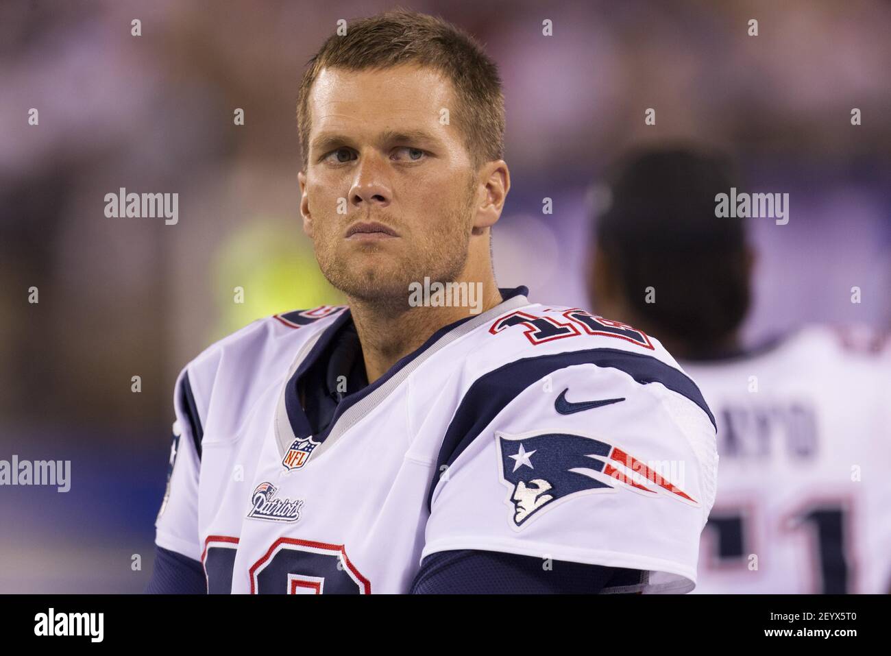 29 August 2012 - East Rutherford, New Jersey - New England Patriots  quarterback Tom Brady (12) looks on with his helmet off during the NFL  preseason game between the New England Patriots