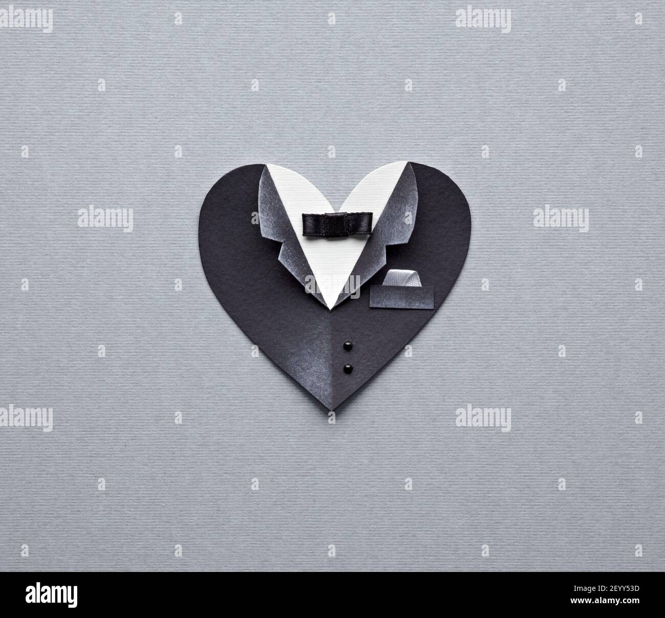 Symbolic male heart shape on gray paper background Stock Photo