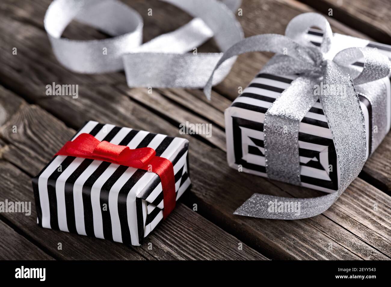 Gift boxes with curved silver ribbon Stock Photo