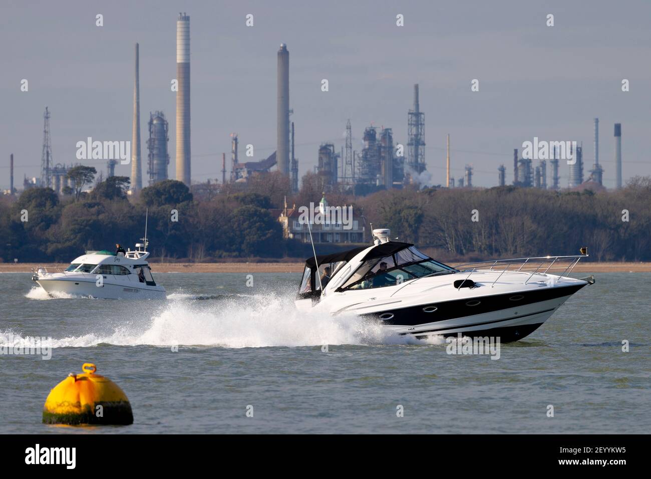 expensive,power,boat,boating,Fawley.Oil.Refinery,The Solent,Cowes,Isle of Wight,England,UK, Stock Photo