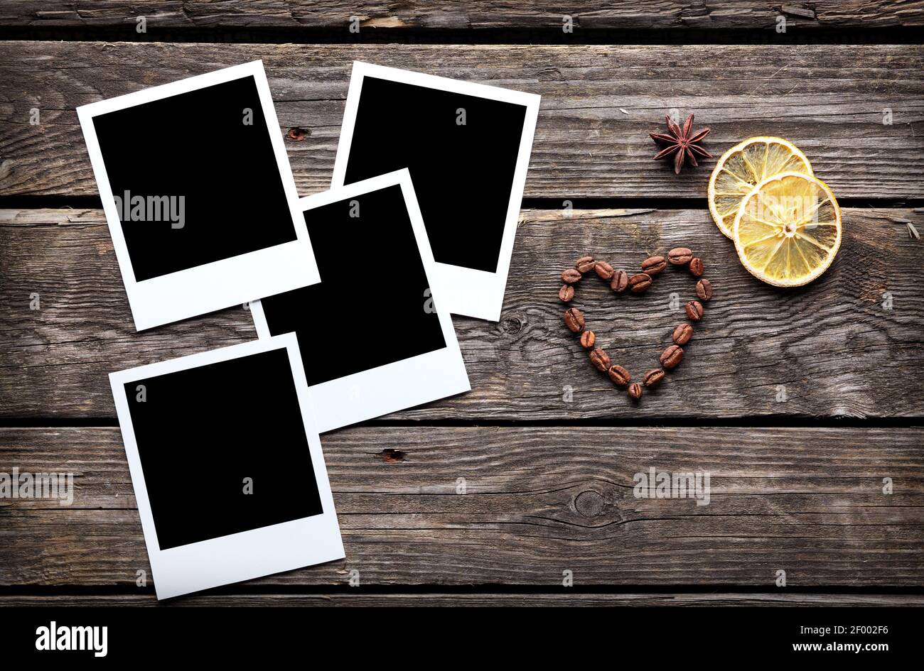 Four blank instant photo frames with coffee beans Stock Photo