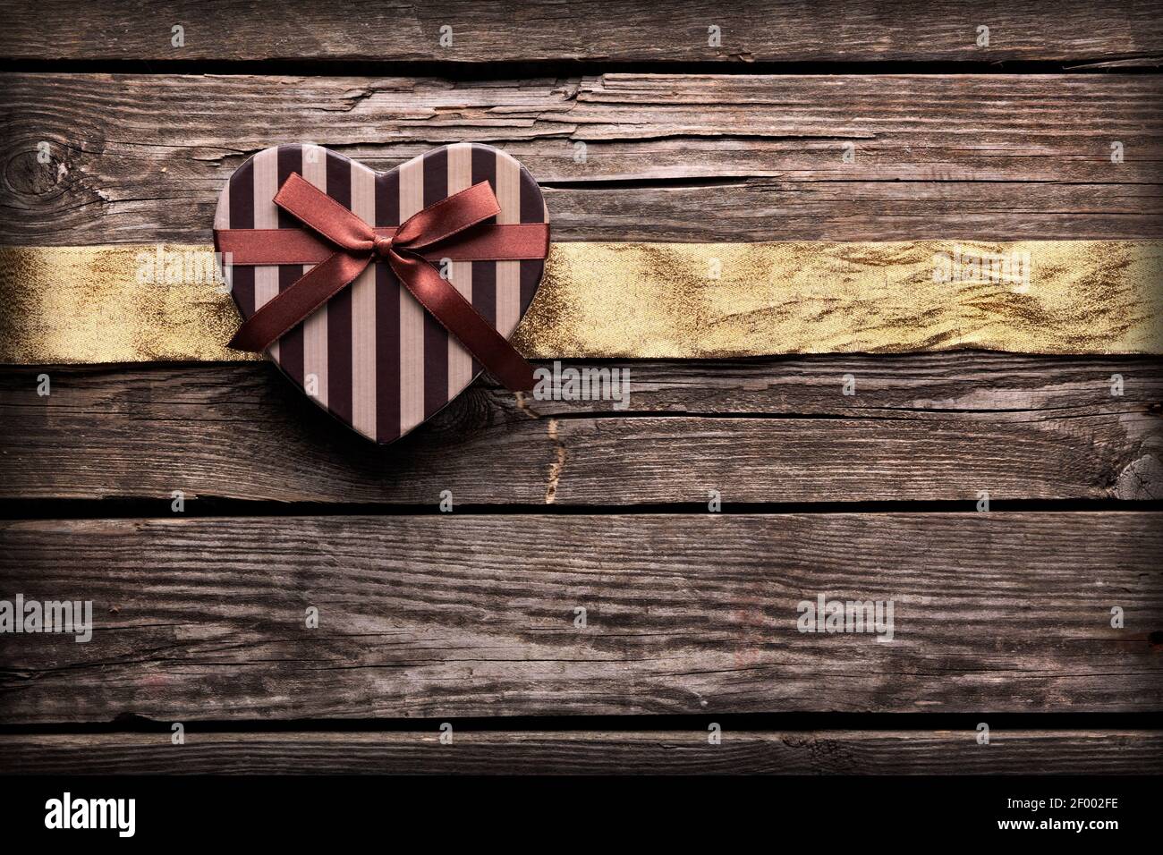 Heart shaped Valentines Day gift box with ribbon Stock Photo