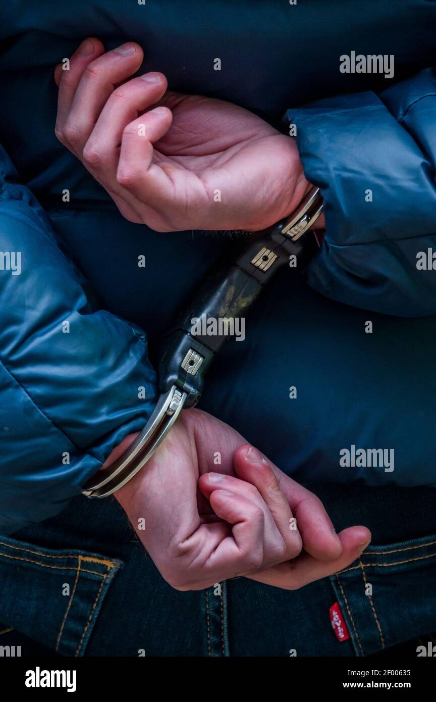 London, UK. 6th Mar, 2021. An arrest after refusing to go home watched and filmed by female supporters - The great reopening protest on Richmond Green. An anti vaccination anti lockdown protest during the latest full lockdown. Led by Stand Up X, they claim the vaccines are untested and the coronavirus pandemic is a hoax and that lockdown is an infringement of their civil liberties. Credit: Guy Bell/Alamy Live News Stock Photo