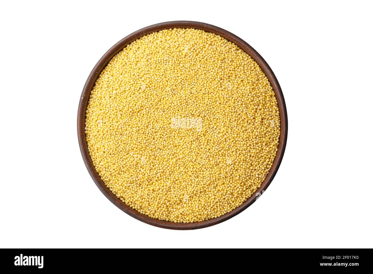 raw millet cereal in a plate on a white background, isolated Stock
