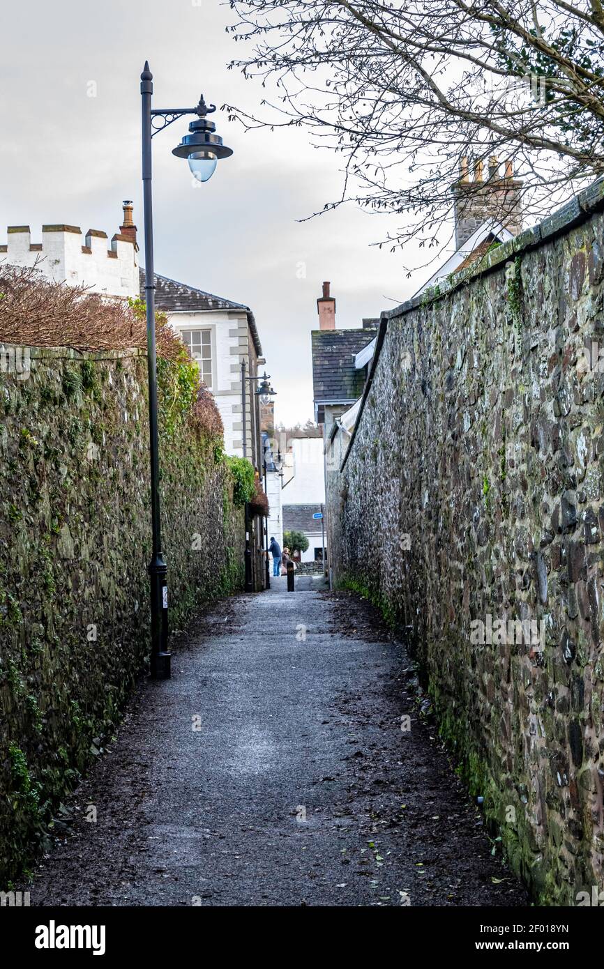 An old stone walled lane from the old High Street to the pier at Kirkcudbright, Dumfries and Galloway, Scotland Stock Photo