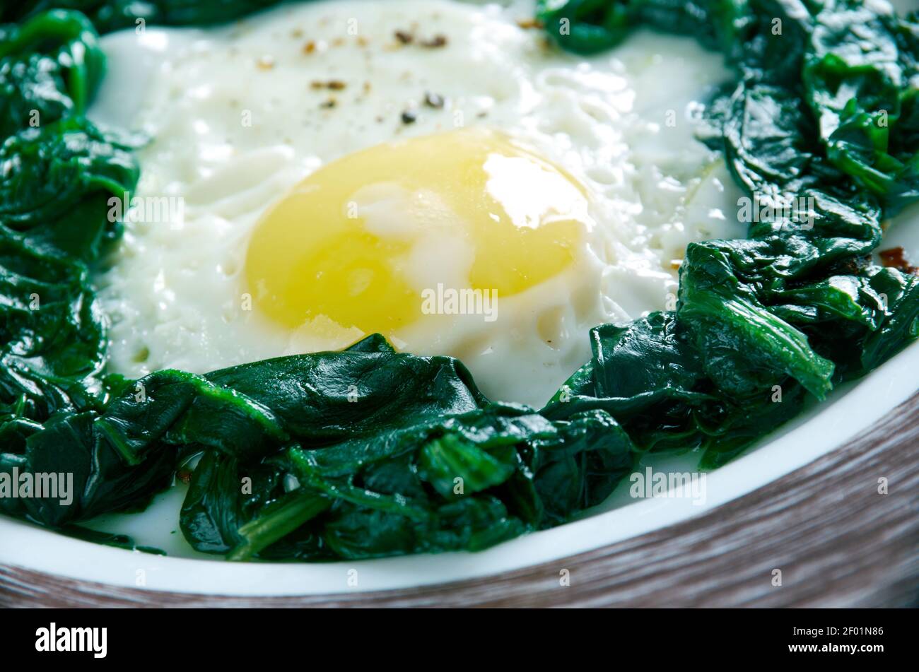 Spinach with eggs Stock Photo - Alamy