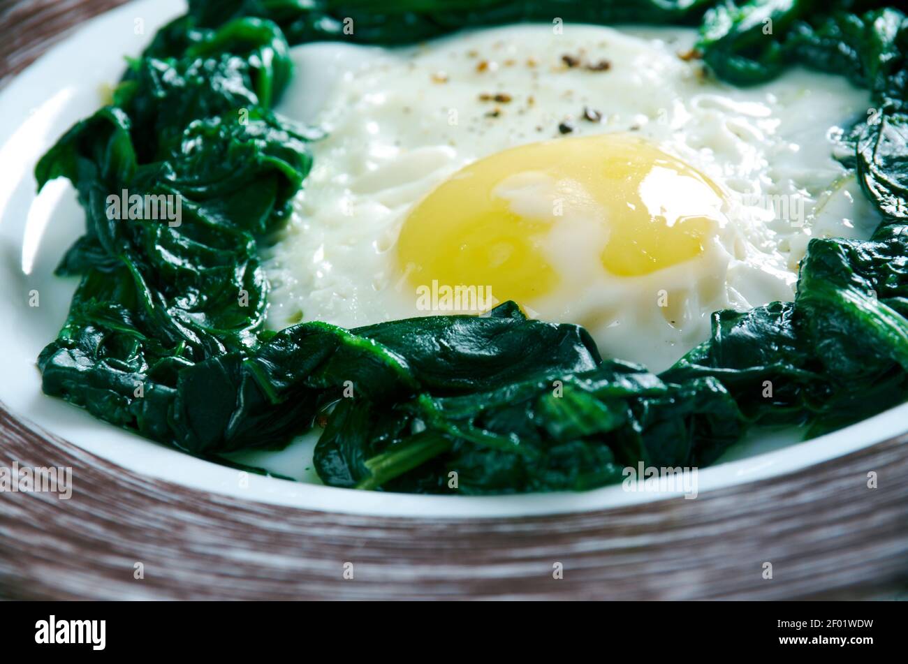 Spinach with eggs Stock Photo - Alamy