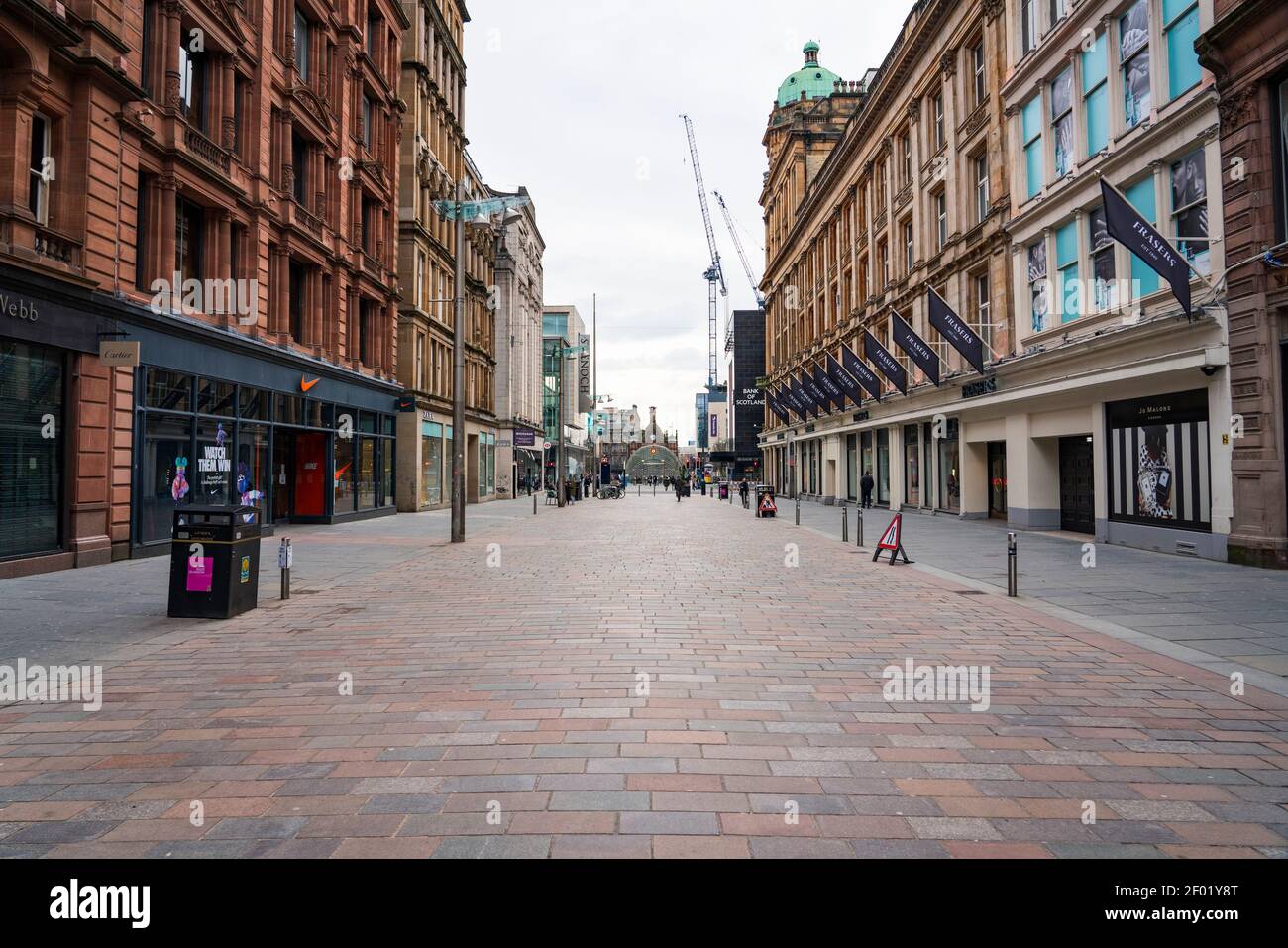 Glasgow, Scotland, UK. 6 Mar 2021. With Scotland remaining under national lockdown during the covid-19 pandemic Glasgow city centre remains a virtual ghost town with few people in the city centre and almost all shops and businesses still closed.  Pic; Buchanan Street pedestrian shopping street is almost empty people and all shops are shuttered.  Iain Masterton/Alamy Live News Stock Photo