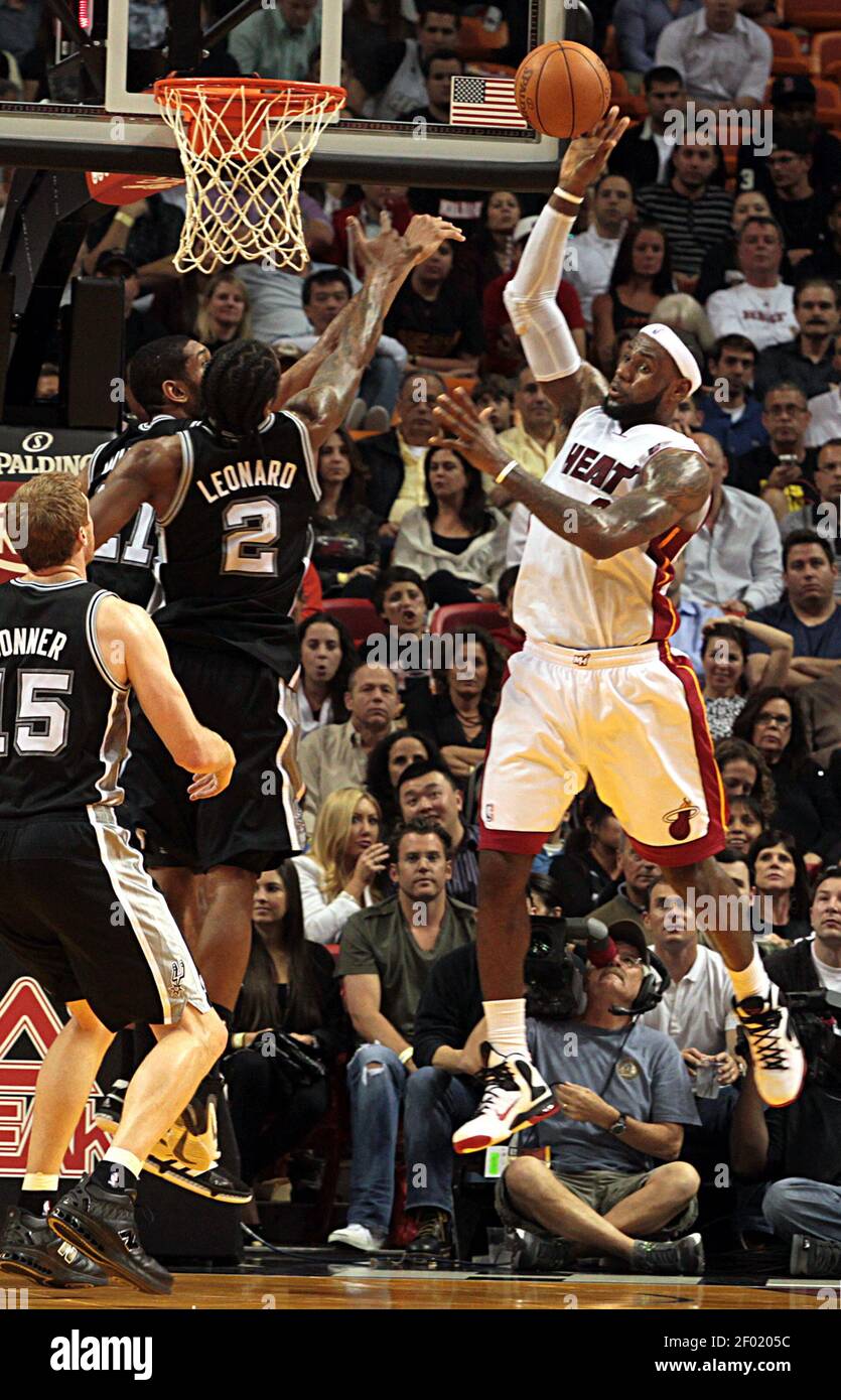 Miami Heat's LeBron James gets control of the ball againstSan Antonio  Spurs' Kawhi Leonard (2) during the first quarter at AmericanAirlines Arena  in Miami, Florida, Tuesday, January 17, 2012. (Photo by Pedro