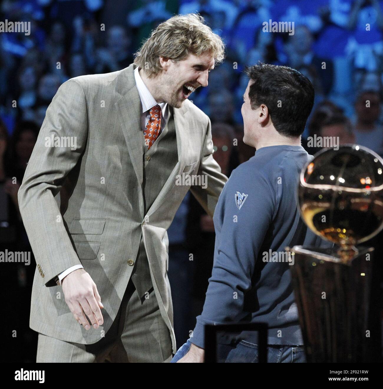 The Dallas Mavericks' Dirk Nowitzki, left, is greeted by owner Mark Cuban  before receiving his championship ring before the team plays host to the  Minnesota Timberwolves at the American Airlines Center in