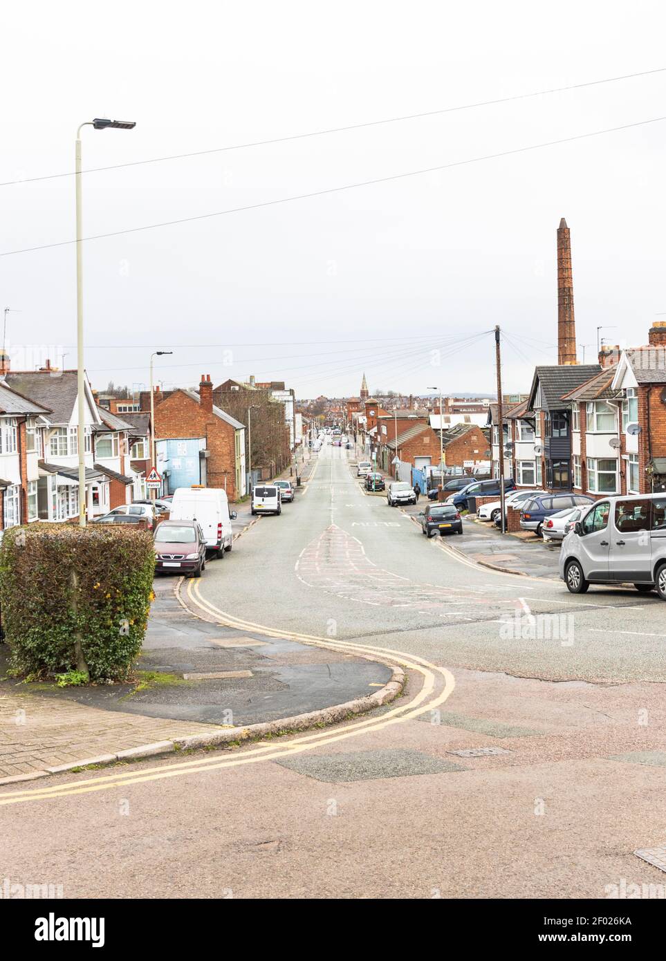 Looks down long road which crosses East Park Road, and over the