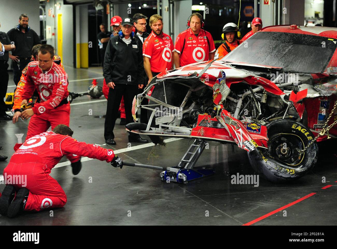 NASCAR Sprint Cup Series driver Juan Pablo Montoya's team looks over
