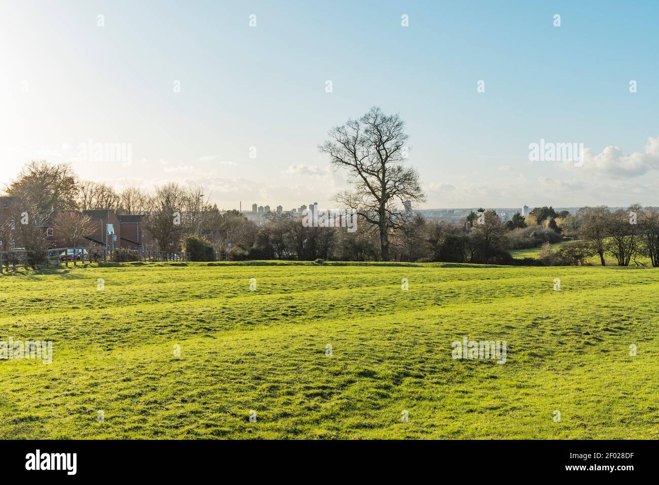 Rooftops, countryside, trees, fields, and high buildings in Leicester city centre, then with Charnwood Forest in the distance. Leicester city skyline. Stock Photo