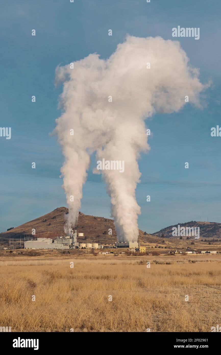 A cloud of steam rises from a power plant seen from the Klamath Wildlife Area near Klamath Falls