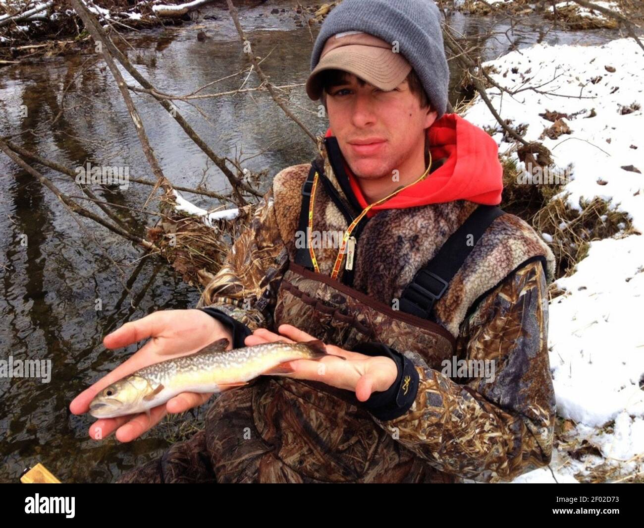 Taylor Helmuth, 18, of Wisconsin Rapids, holds a tiger trout, a rare