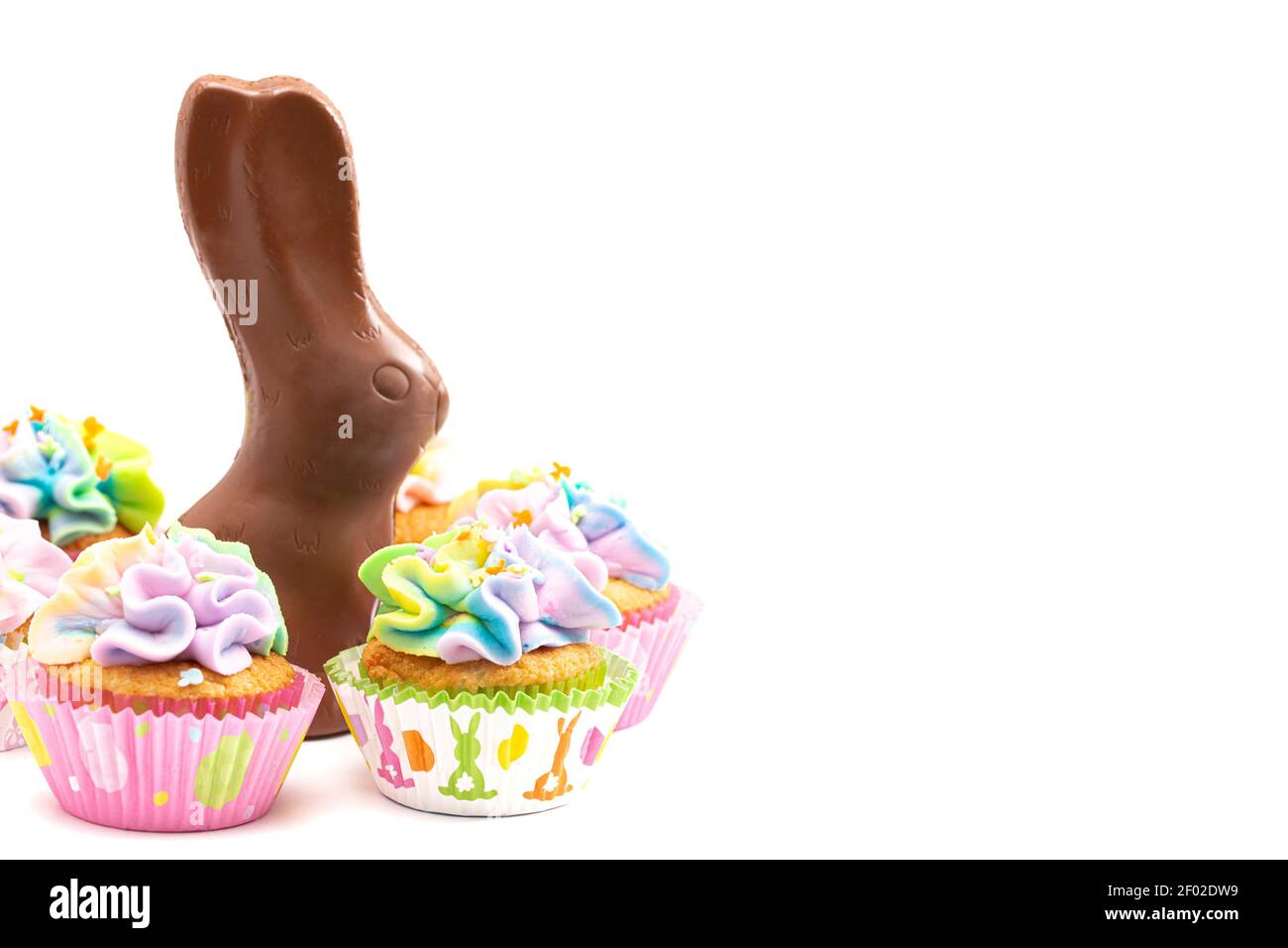 Chocolate Easter Bunny and Cupcakes Isolated on a White Background Stock Photo
