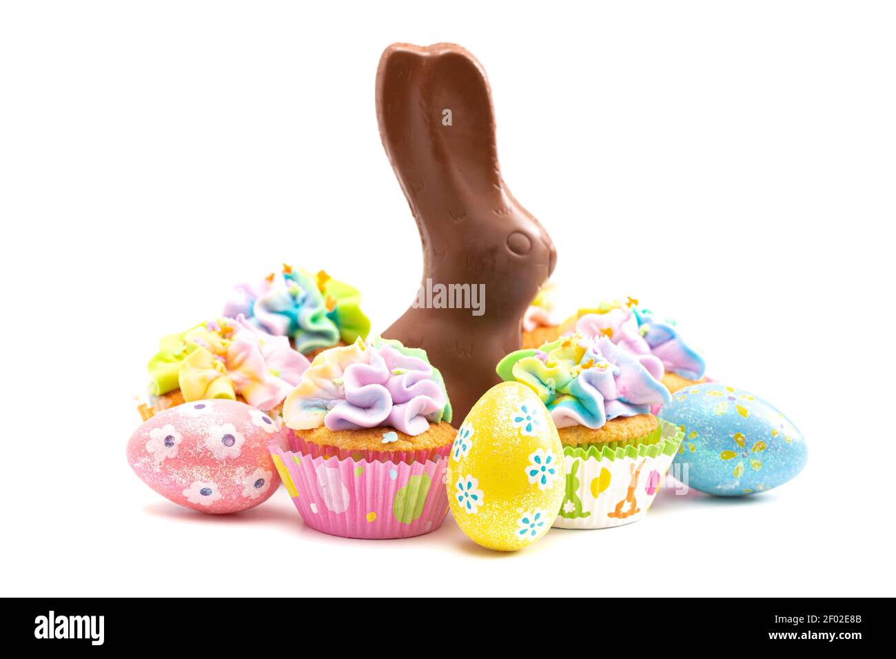 Chocolate Easter Bunny and Cupcakes Isolated on a White Background Stock Photo