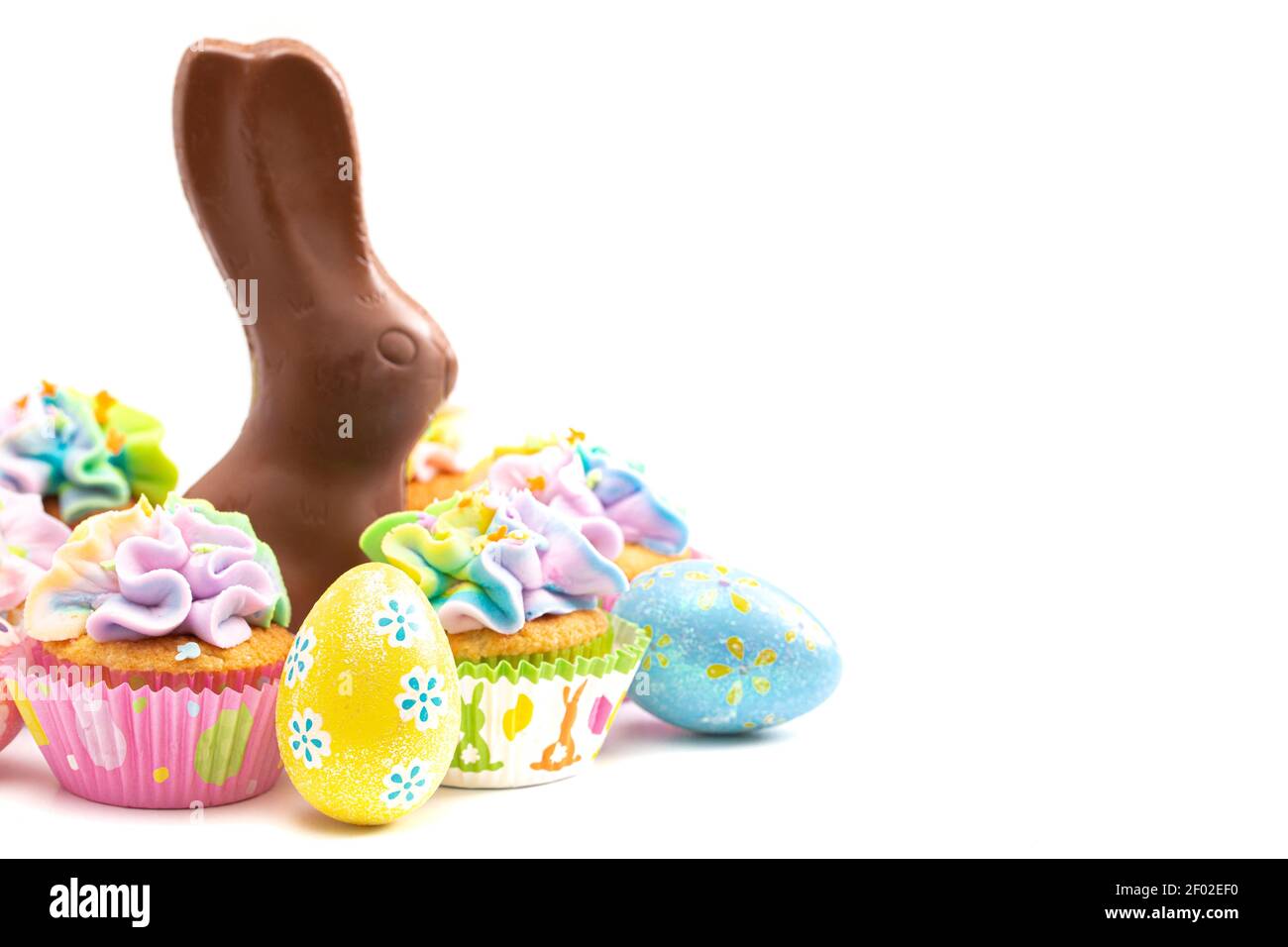 Chocolate Easter Bunny and Cupcakes Isolated on a White Background Stock Photo