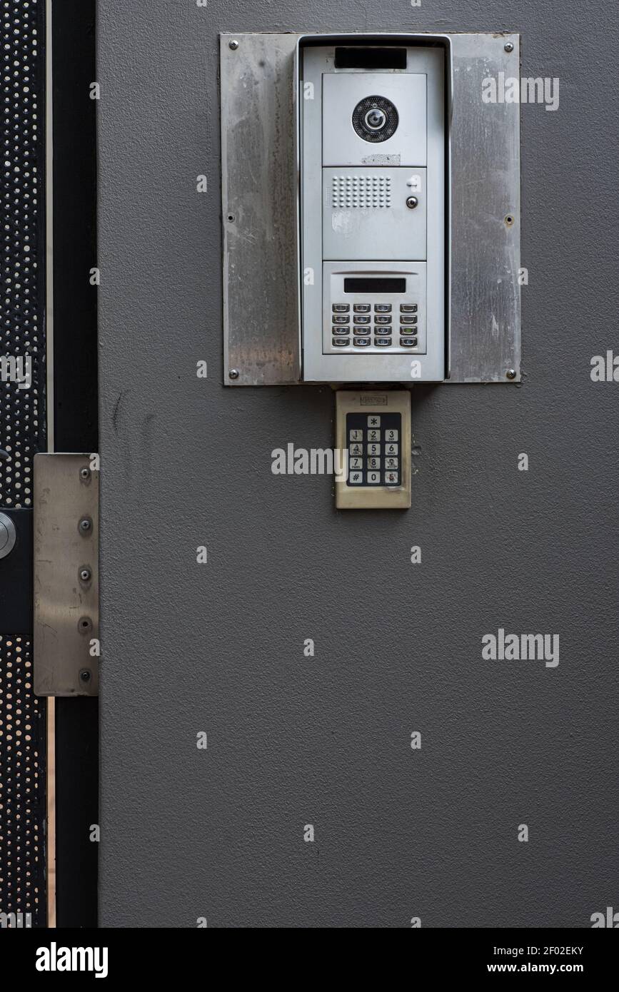 A vertical shot of a control panel hanging on a grey wall Stock Photo ...
