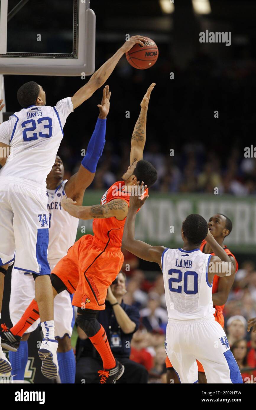 Anthony Davis (23) of Kentucky blocks the shot of Peyton Siva (3) of  Louisville in second-half action in the NCAA Tournament semifinals at the  Mercedes-Benz Superdome in New Orleans, Louisiana, on Saturday,, image size:866x1390