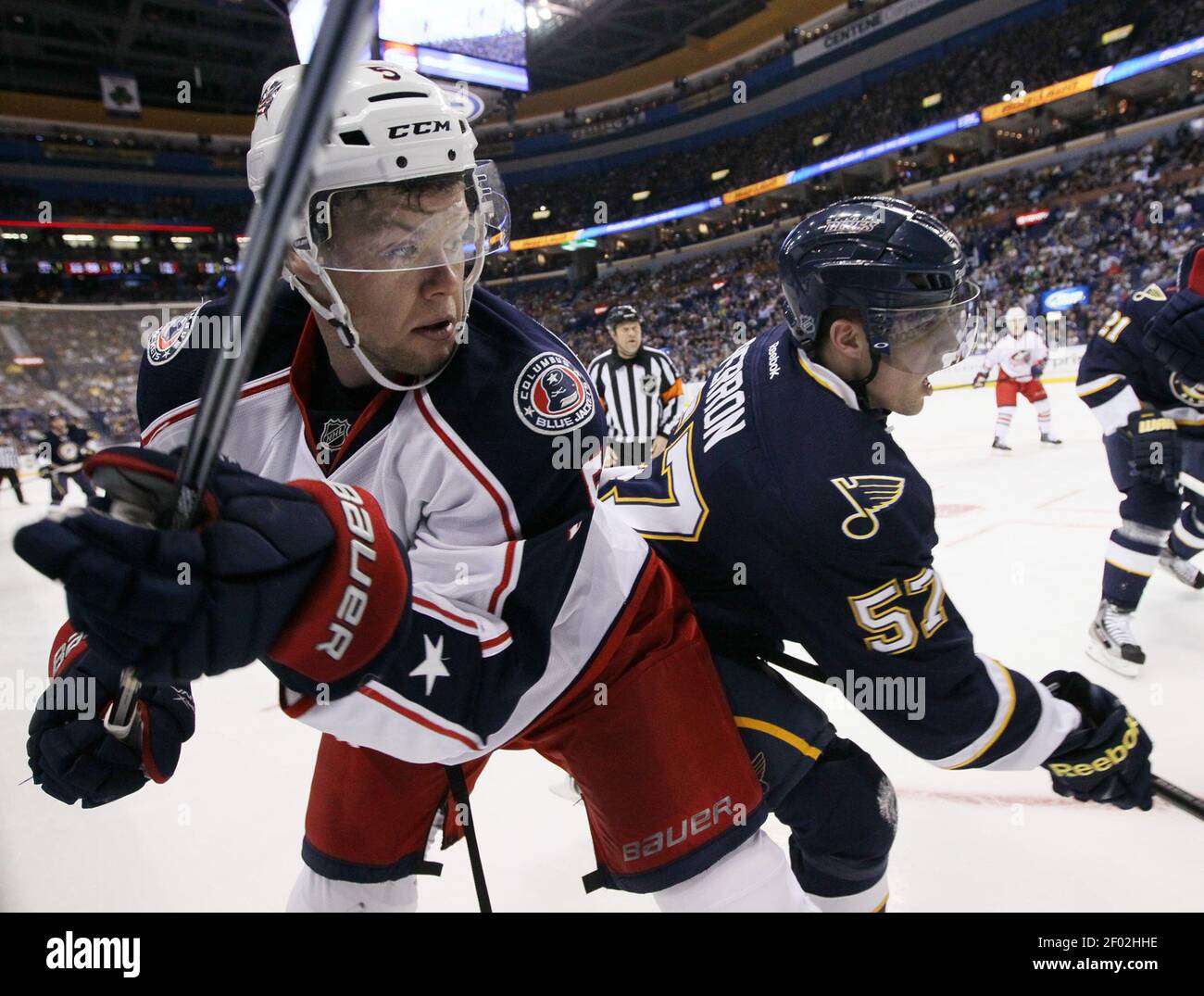 Columbus Blue Jackets defenseman Aaron Johnson,left, and St. Louis ...