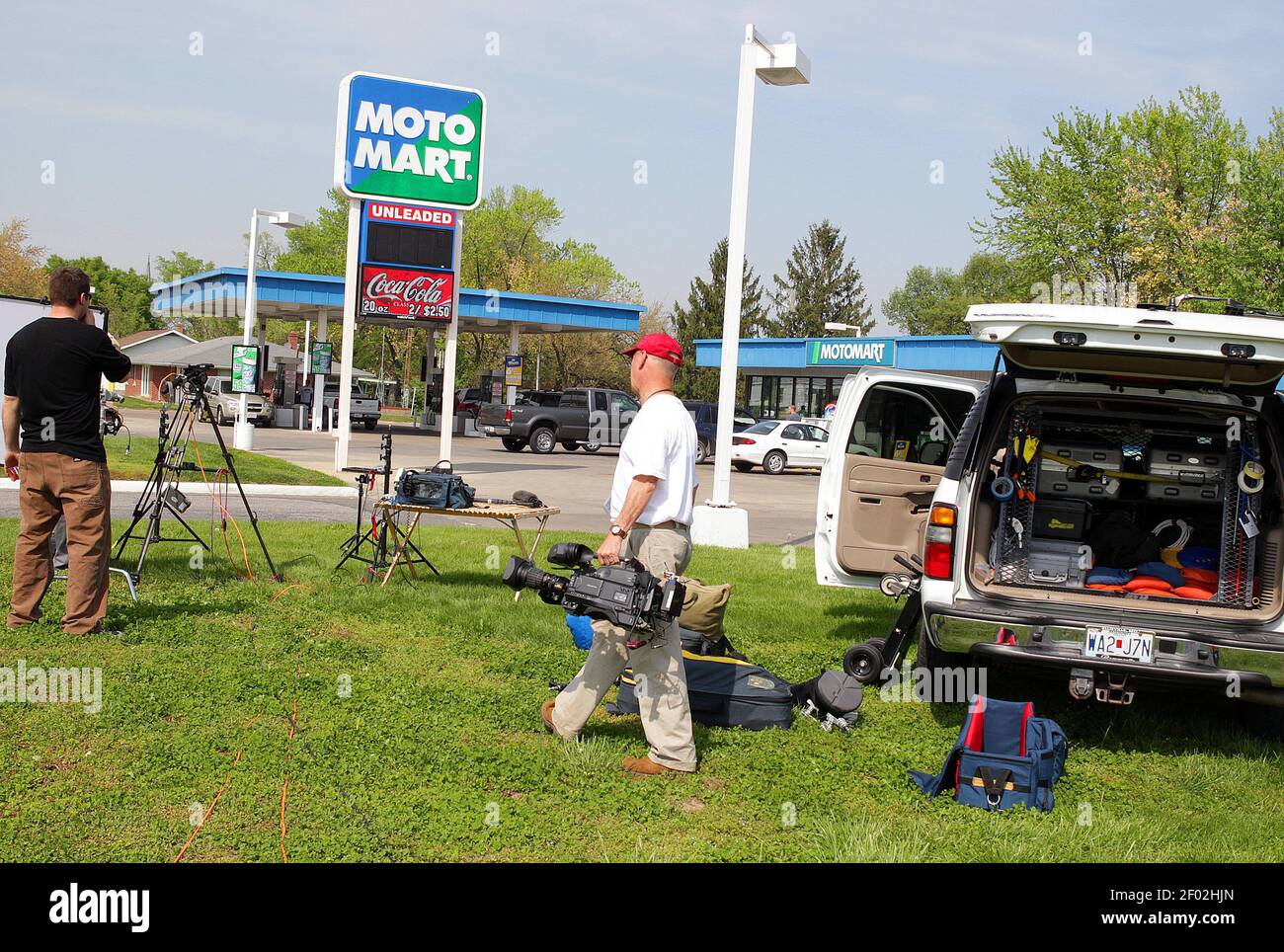 A television crew sets up at the MotoMart in Red Bud, Illinois on