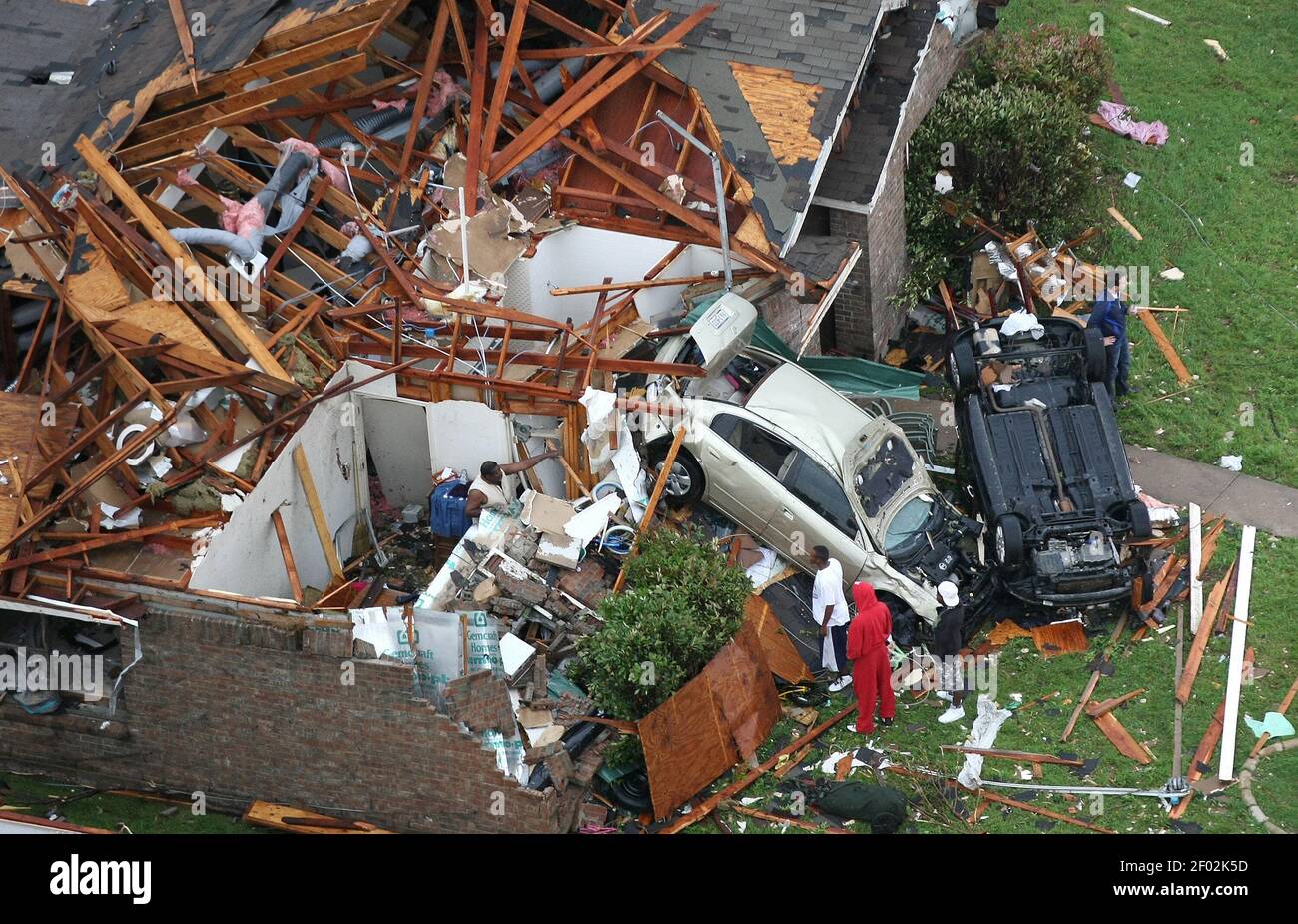 Residents survey damages caused by a tornado that touced down in ...