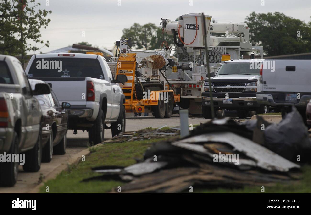 An electrical crew drives into a industrial area in Kennedale, Texas