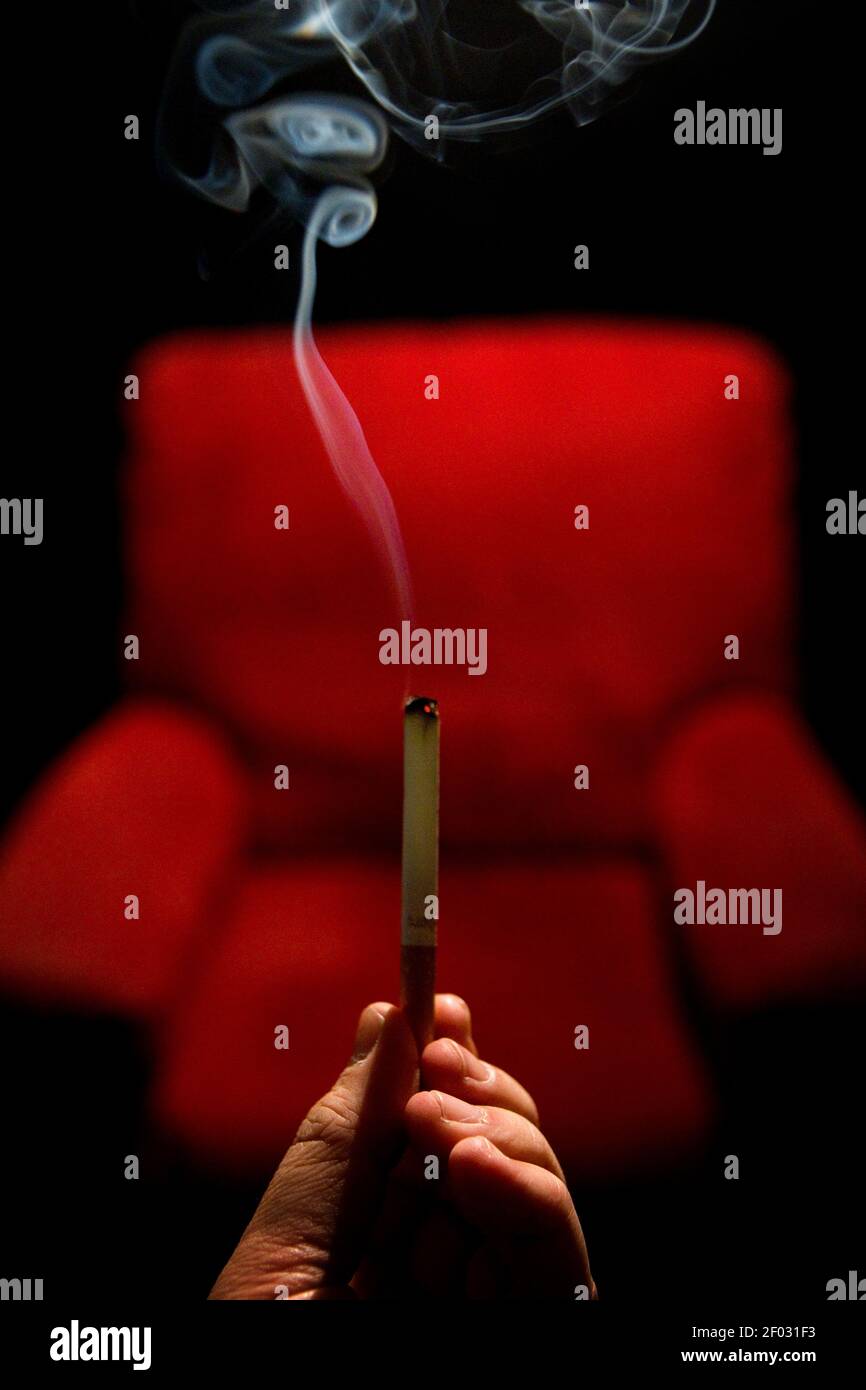 This photo illustration of a cigarette and a sofa chair is used to
