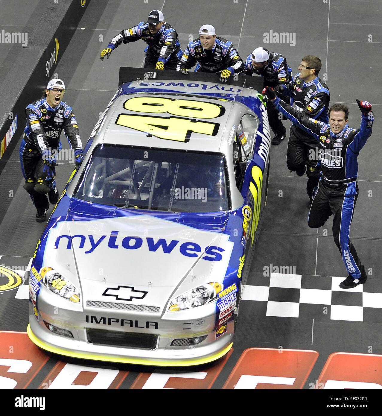 NASCAR Sprint Cup Series driver Jimmie Johnsons pit crew begin to celebrate their victory in the NASCAR Sprint Cup Series Pit Crew Challenge at Time Warner Cable Arena in Charlotte, North Carolina