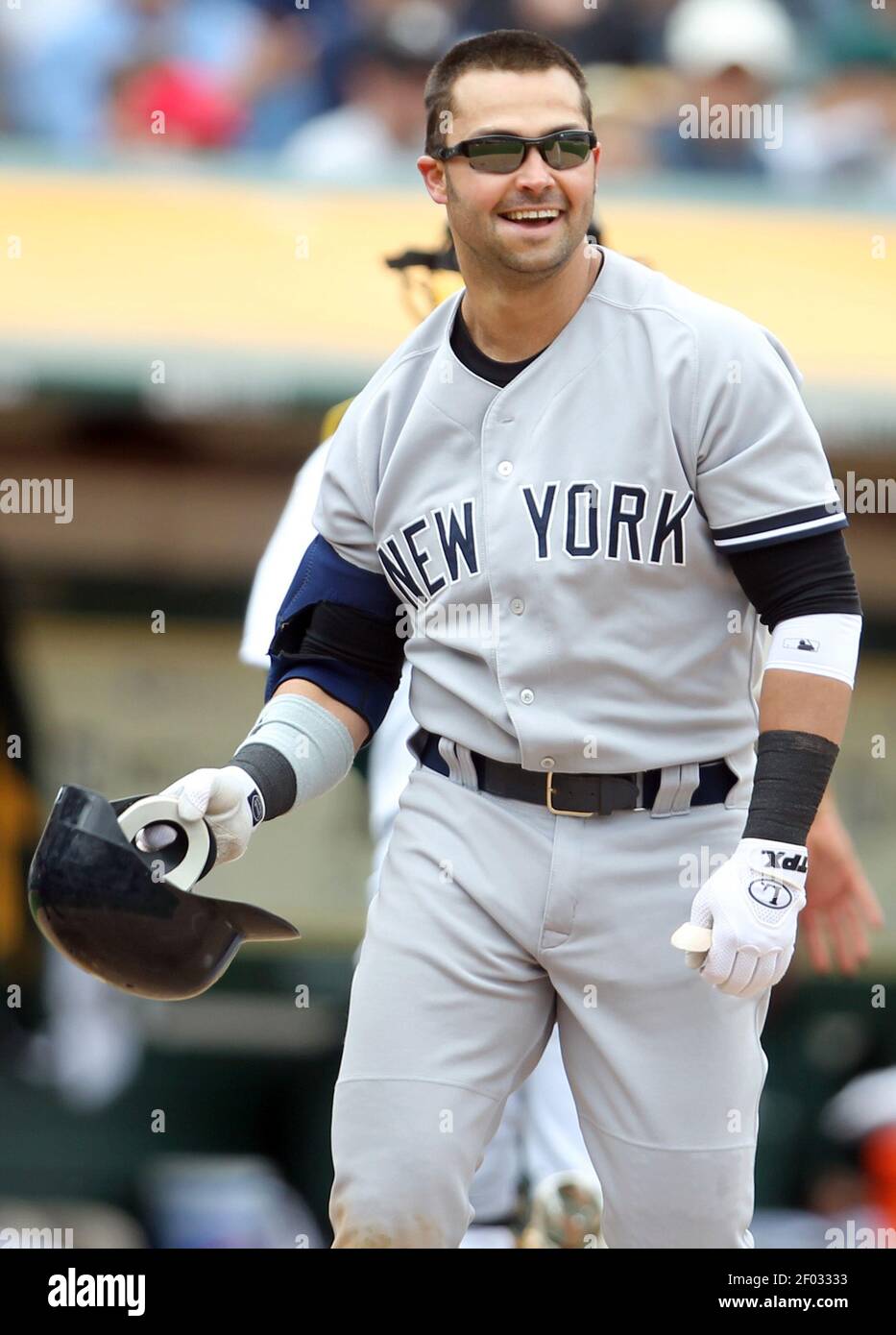 The New York Yankees' Nick Swisher smiles after striking out to