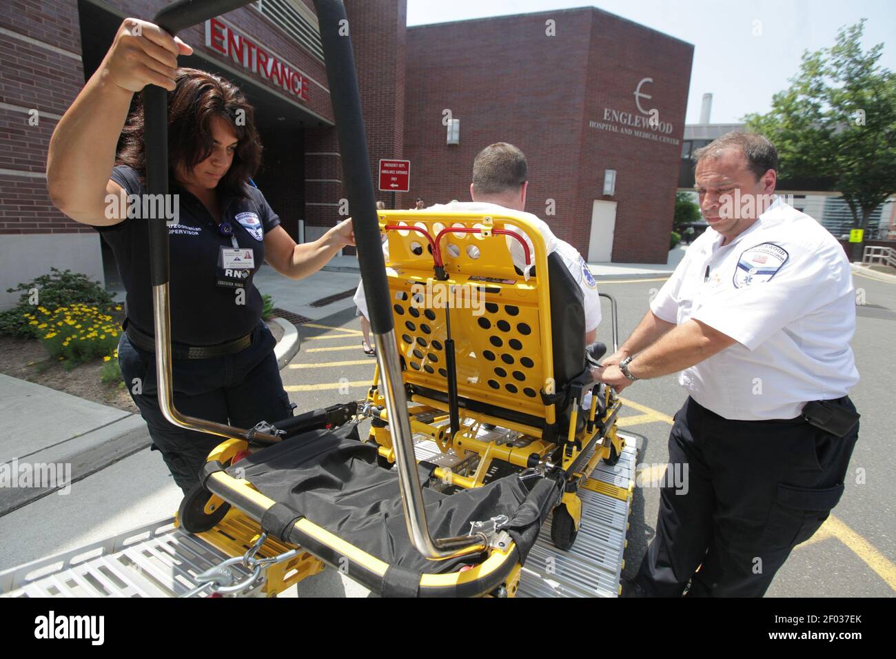 Denise Arzoomanian, left, and Steve Cicala, right, lifts Harvey Weber