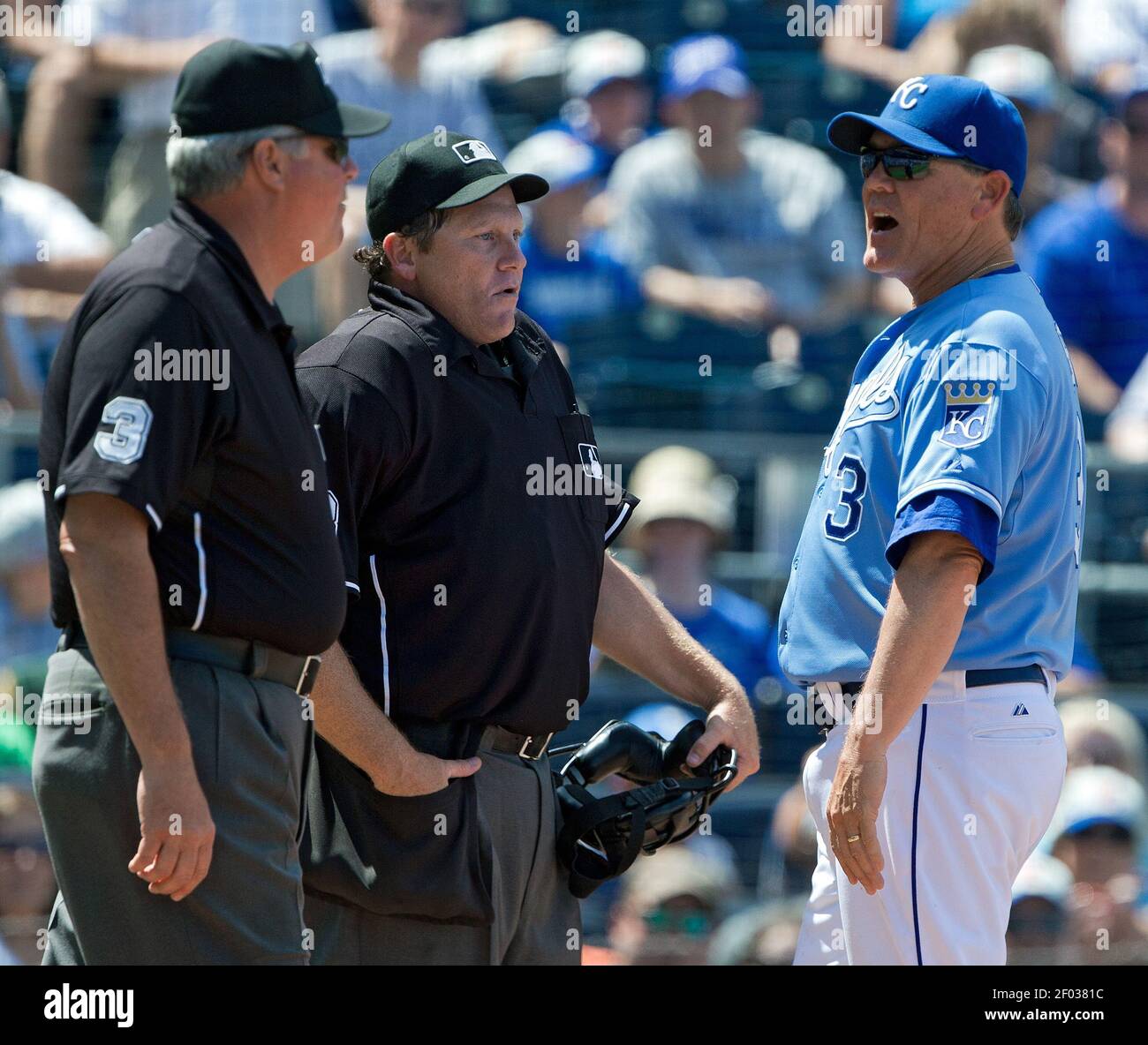 Kansas City Royals manager Ned Yost, right, tries to argue with home