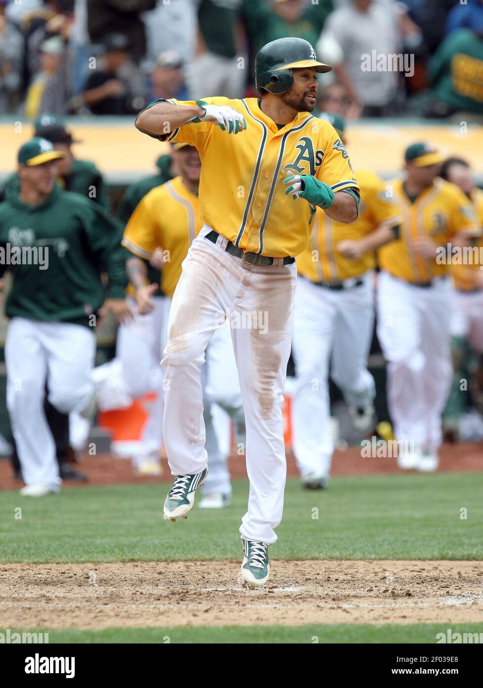 The Oakland Athletics Coco Crisp Celebrates After Scoring On Yoenis Cespedes Three Run Walk Off Home Run Against The Los Angeles Dodgers At O Co Coliseum In Oakland California Thursday June 21 12 The A S