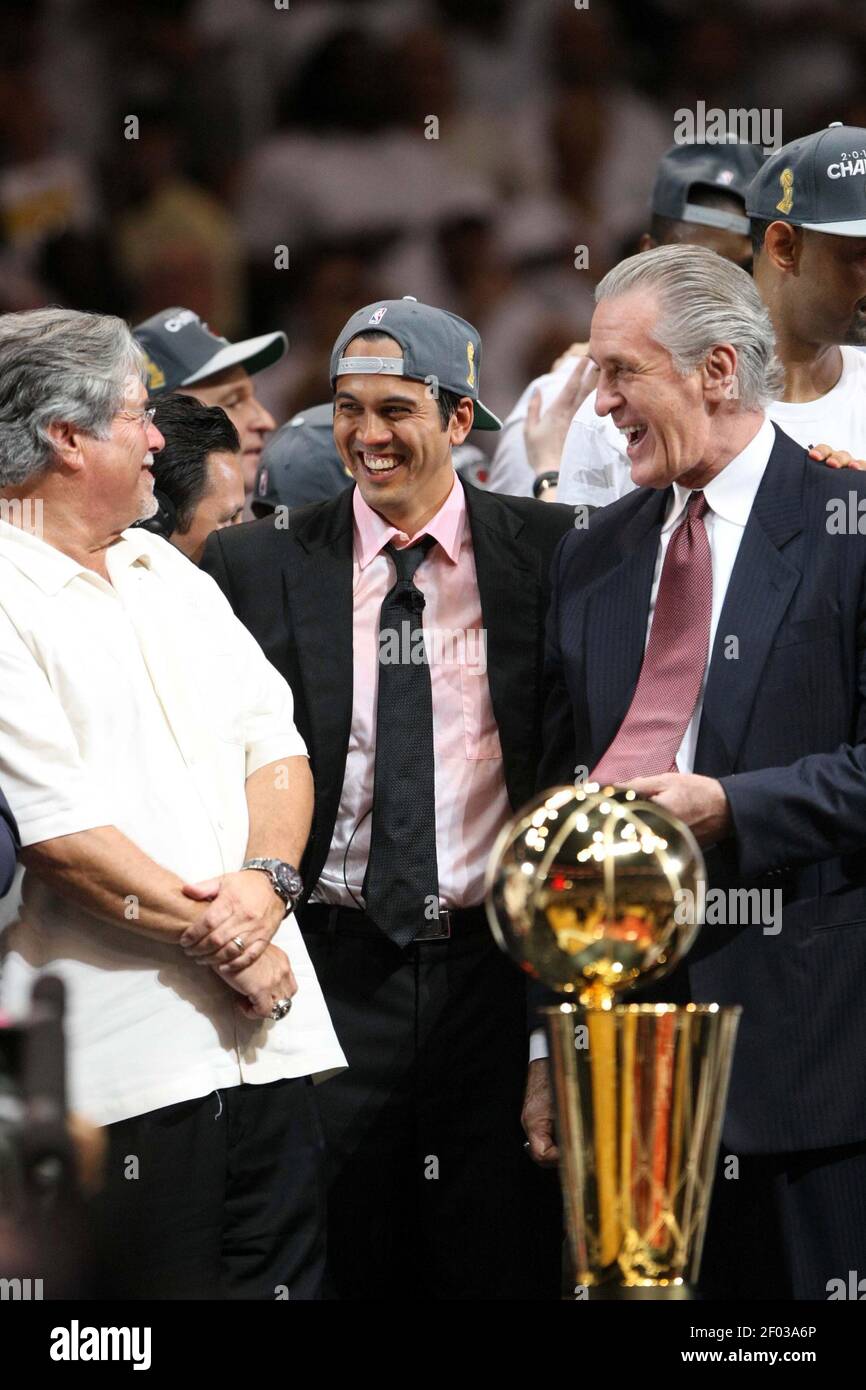Miami Heat President Pat Riley, right, Head head coach Erik Spoelstra,  center, and Heat owner Micky Arison celebrate an NBA championship, after  the Heat defeated the Oklahoma City Thunder 121-106 in Game