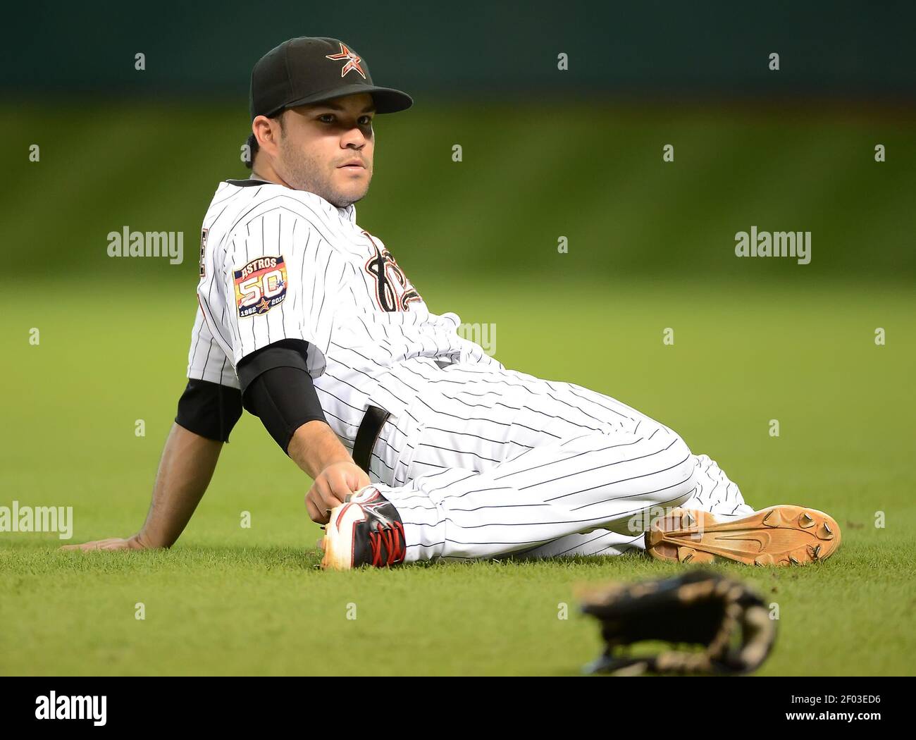 Jose Altuve (27) of the Houston Astros stretches before a game against the  Cincinnati Reds on Tuesday, July 24, 2012, in Houston, Texas. (Photo by  George Bridges/MCT/Sipa USA Stock Photo - Alamy
