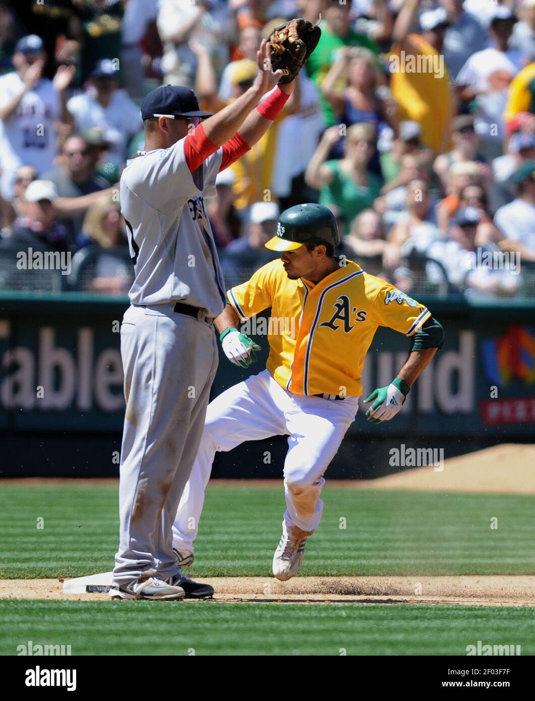 The Oakland Athletics Coco Crisp 4 Pops Up Safely At Third With A Lead Off Triple Against The Boston Red Sox In The 7th Inning At O Co Coliseum In Oakland California On