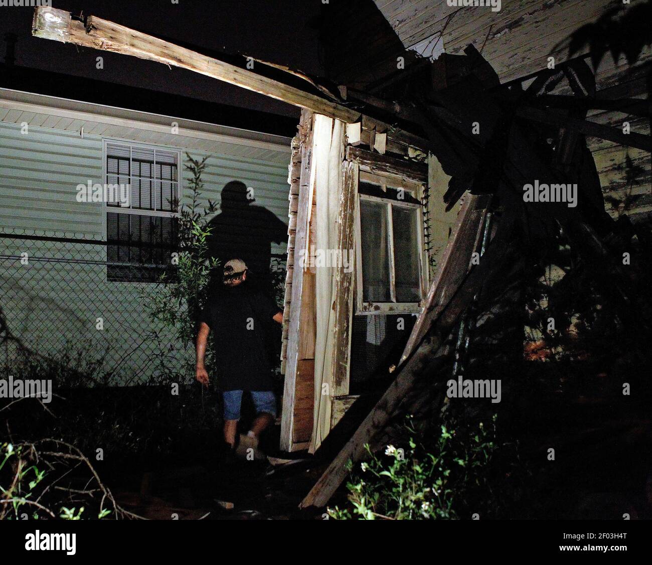 A homeless man who lives in a abandoned blighted house central city of