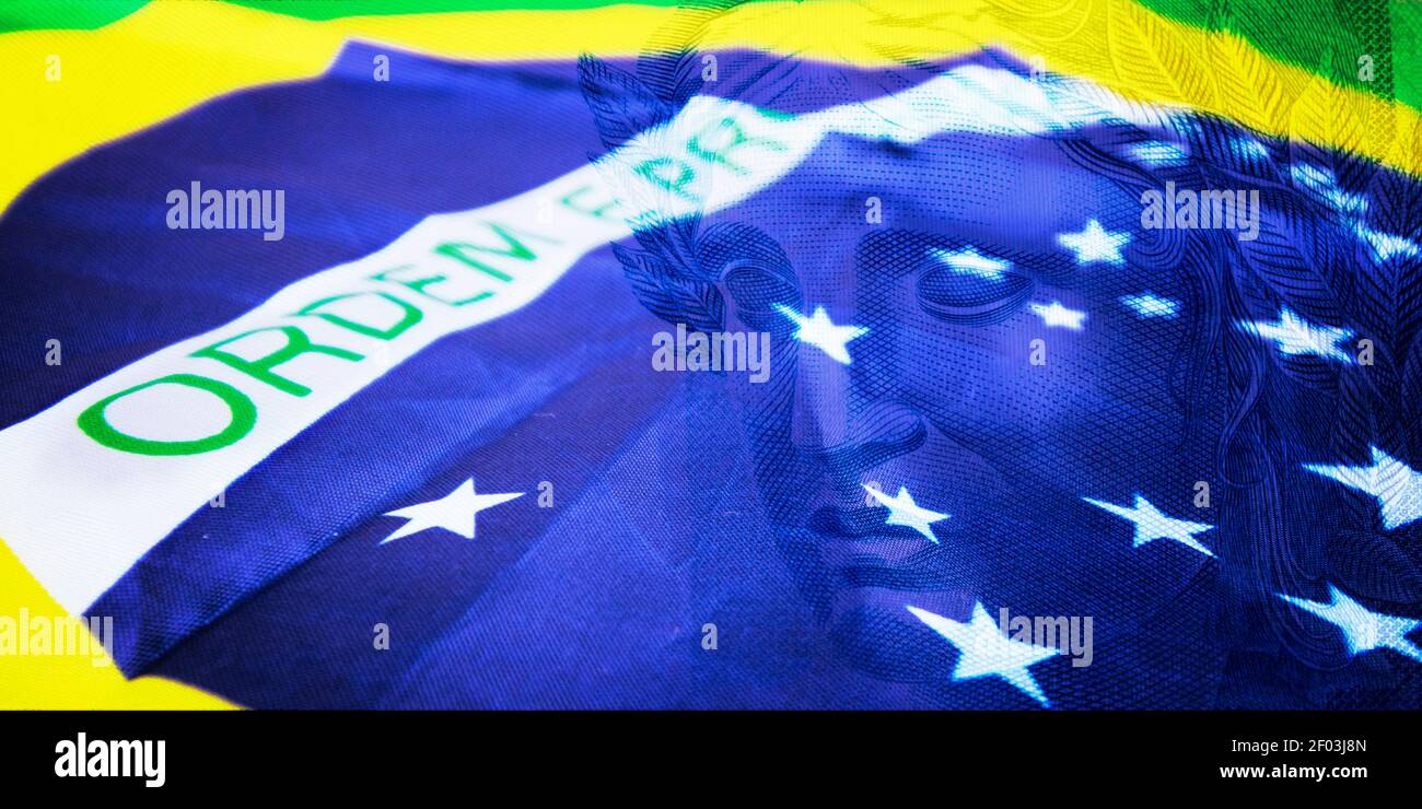 Brazilian money called Real and flag of Brazil image concept Stock Photo