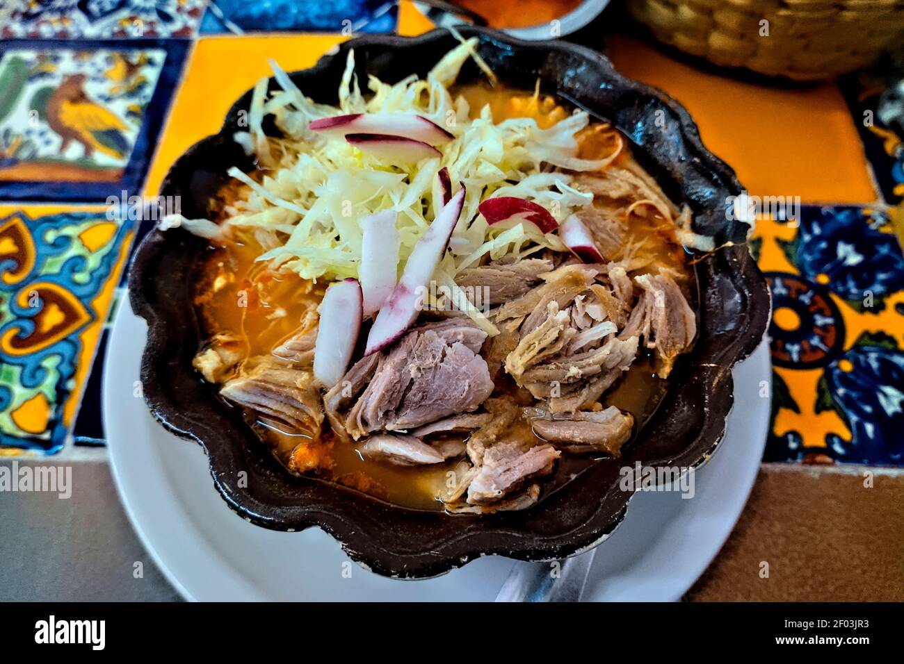 Spicy red pozole, a speciality in Guadalajara, Jalisco, Mexico Stock Photo