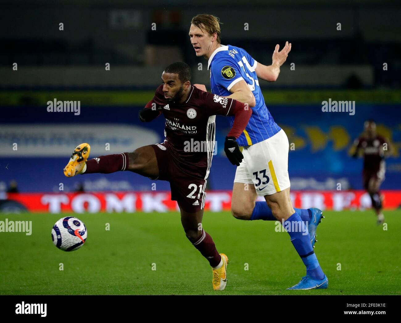 Leicester City's Ricardo Pereira (left) and Brighton and Hove Albion's Dan Burn battle for the ball during the Premier League match at the American Express Community Stadium, Brighton. Picture date: Saturday March 6, 2021. Stock Photo