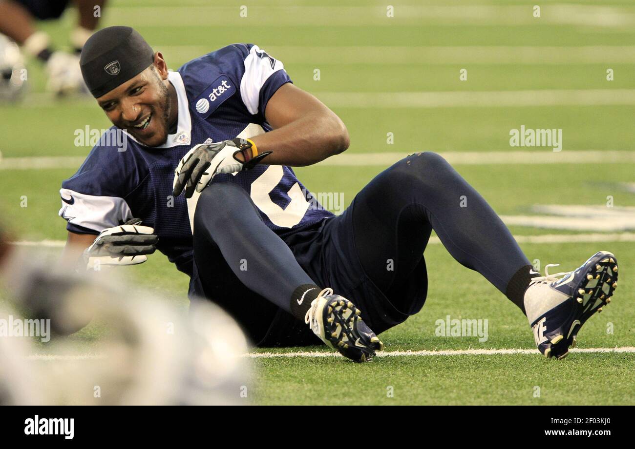 Dallas Cowboys defensive back Barry Church rolls over during stretching
