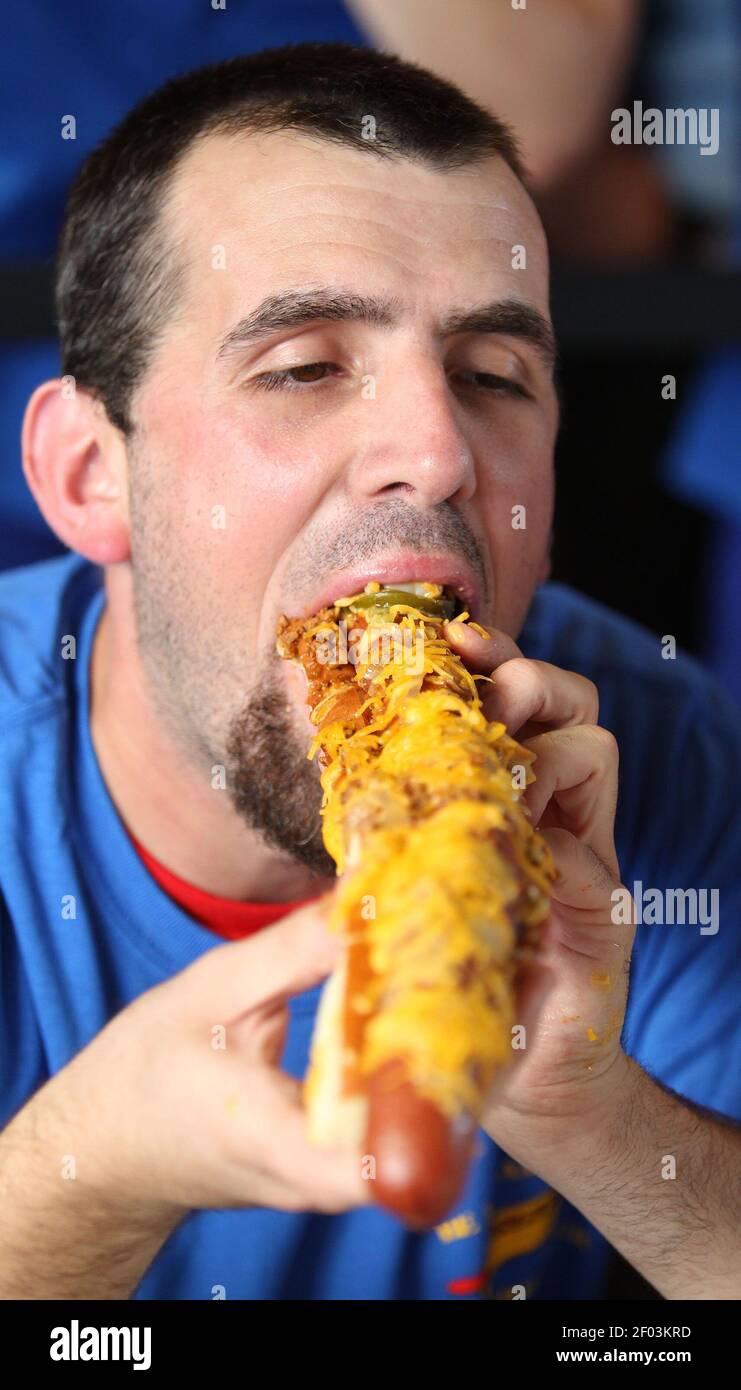 Contestant Michael Bandy during a race to eat the Boomstick, a  two-foot-long, one-pound hotdog sold at Rangers Ballpark in Arlington on  Wednesday, July 25, 2012, in Arlington, Texas. (Photo by Paul Moseley/Fort